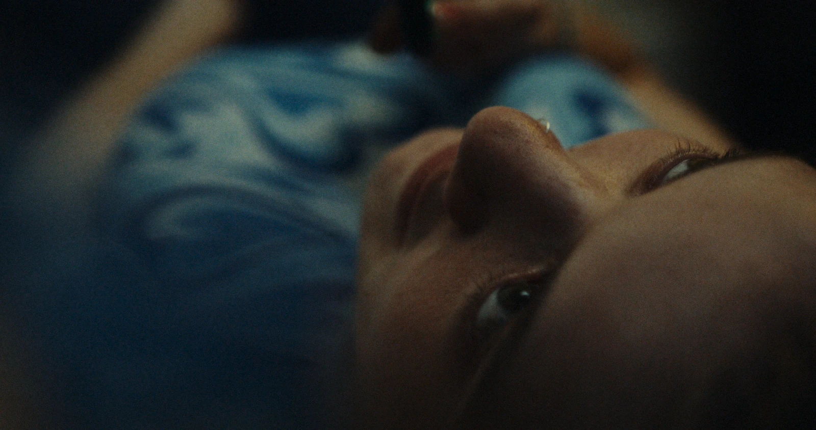 A woman resting, seen in close-up.