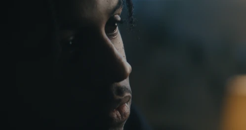 A young person in profile.
